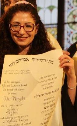 Ordination - Julia proudly displays her certificate
